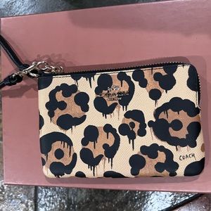 Coach wild beast small single zip wristlet.